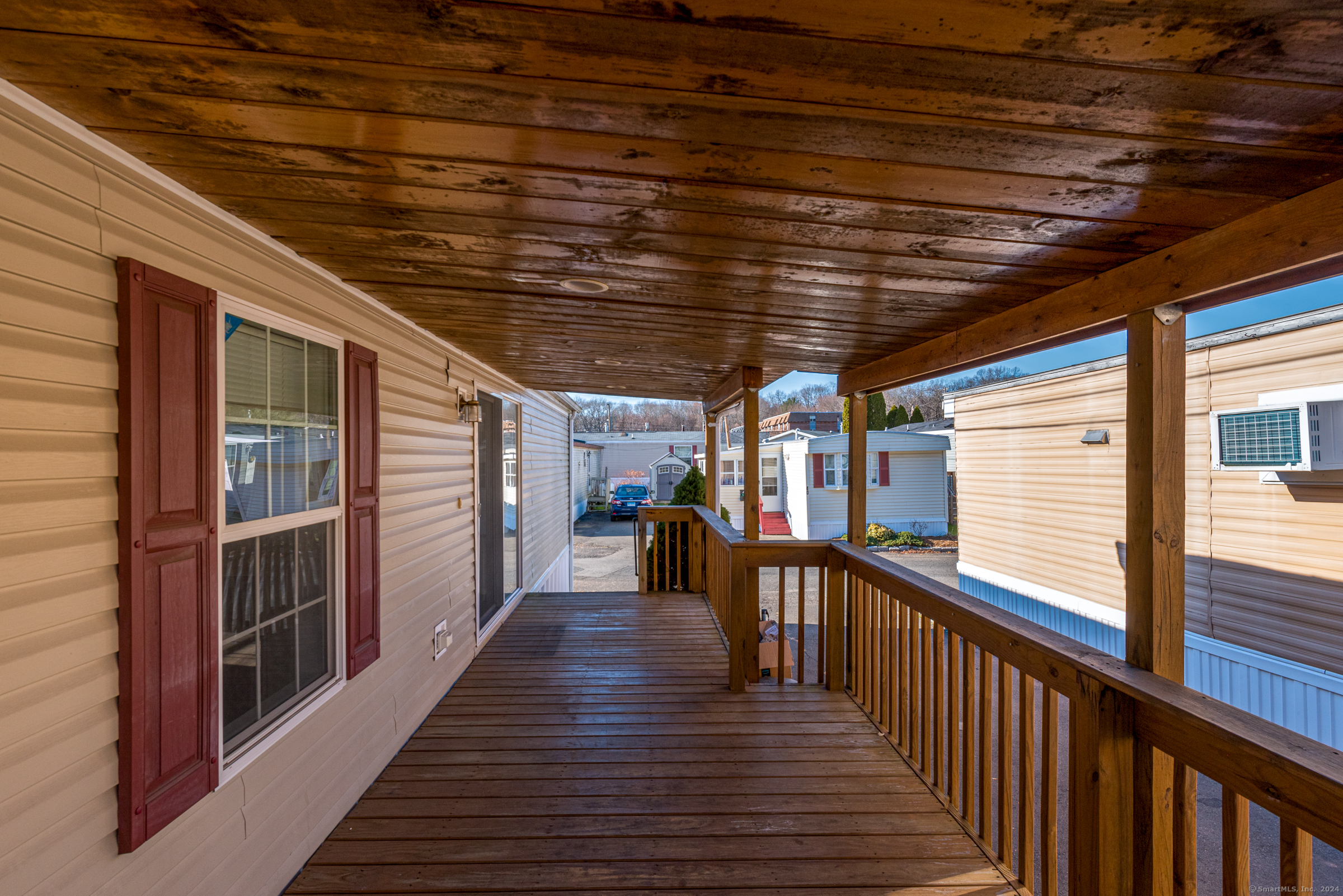 a view of a porch with wooden floor