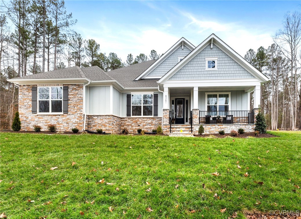 a view of a house with a yard porch and sitting area