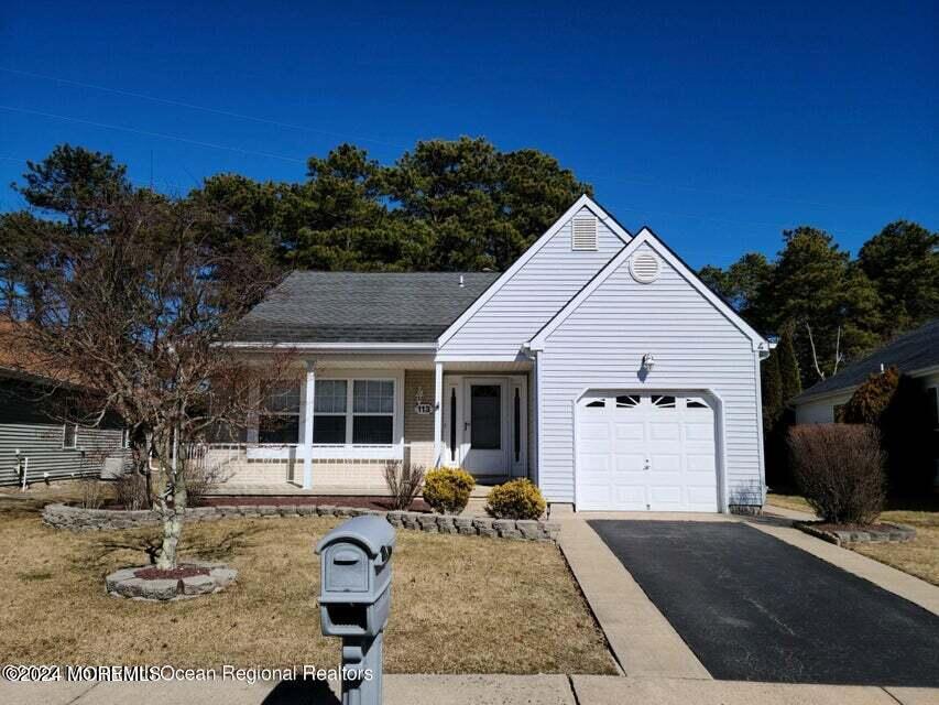 a view of house with backyard space and garden