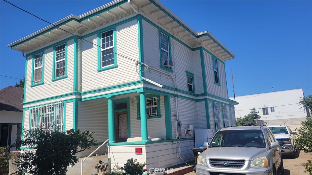 a front view of a house with parking