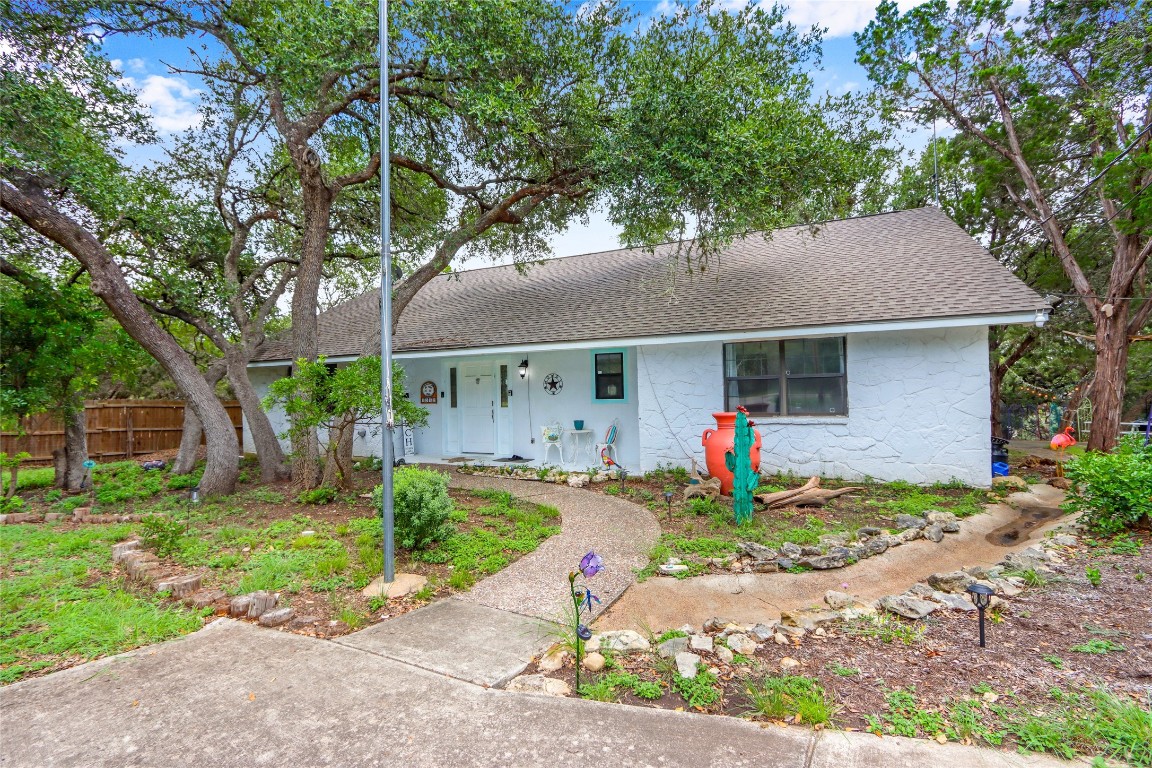 a front view of house with yard and outdoor seating