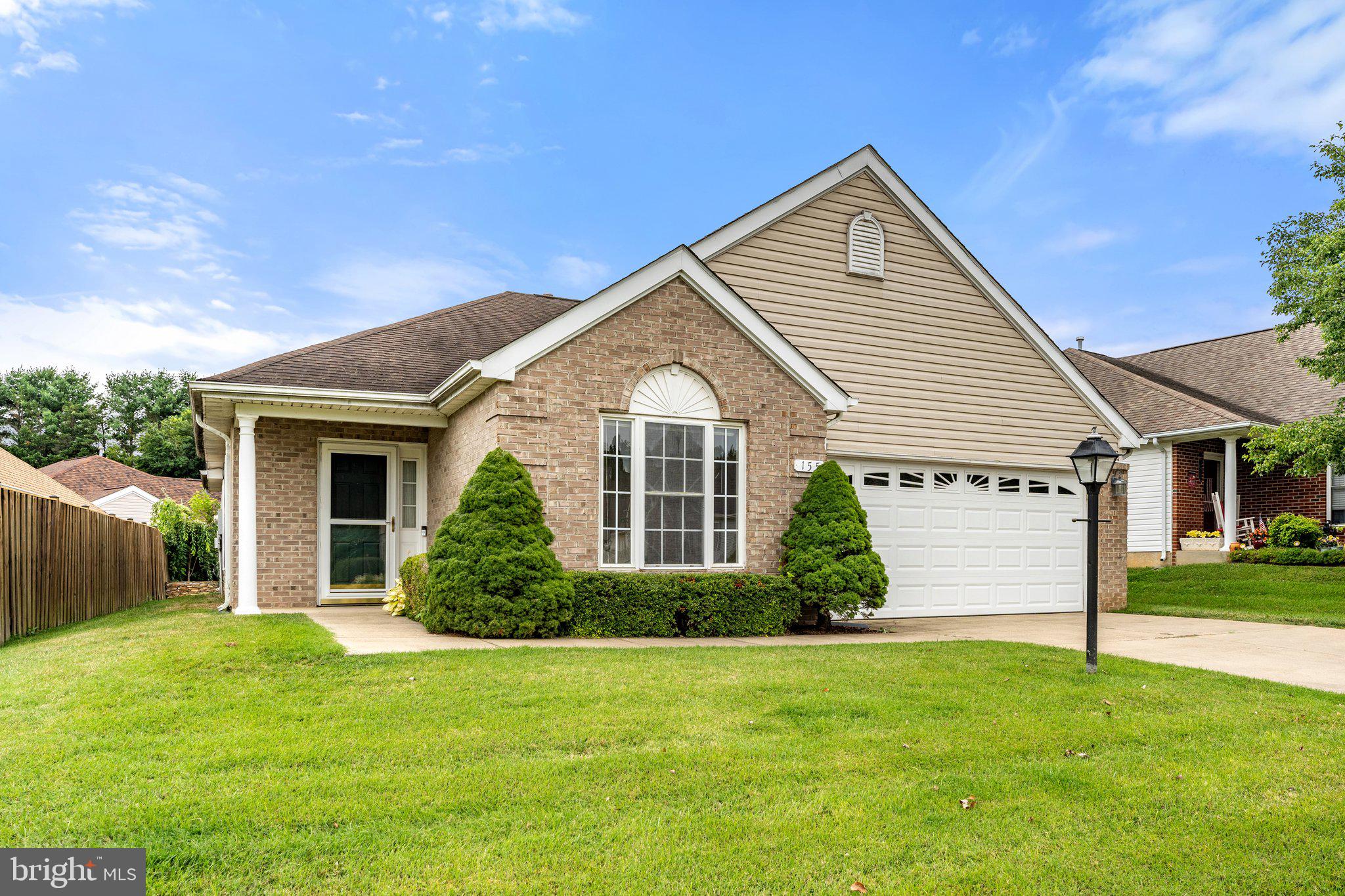 a view of a house with backyard