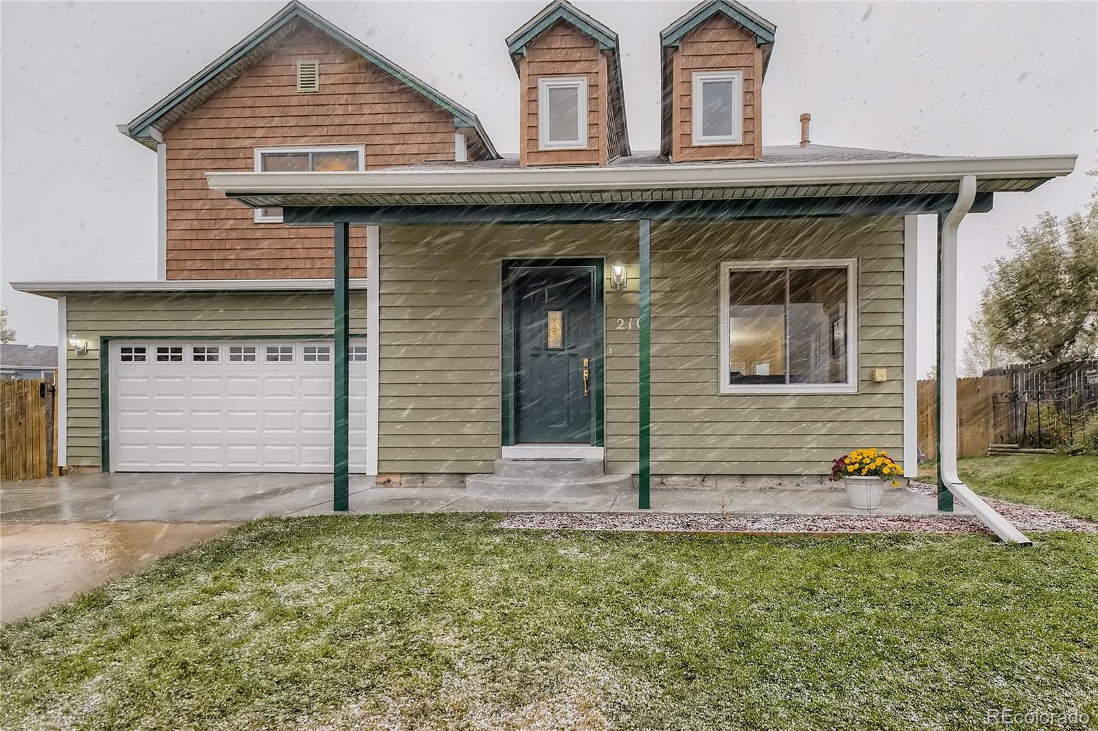 a view of a house with small yard