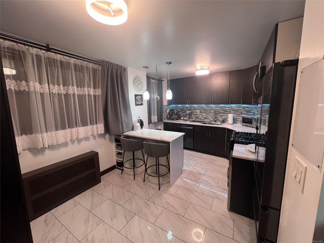 $434,999 | 90-50 Union Turnpike, Unit 1L | Forest Park