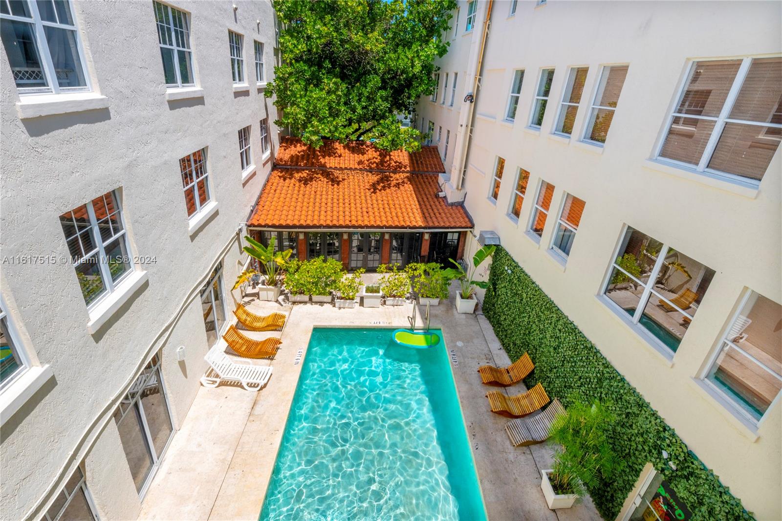 a aerial view of a house with swimming pool