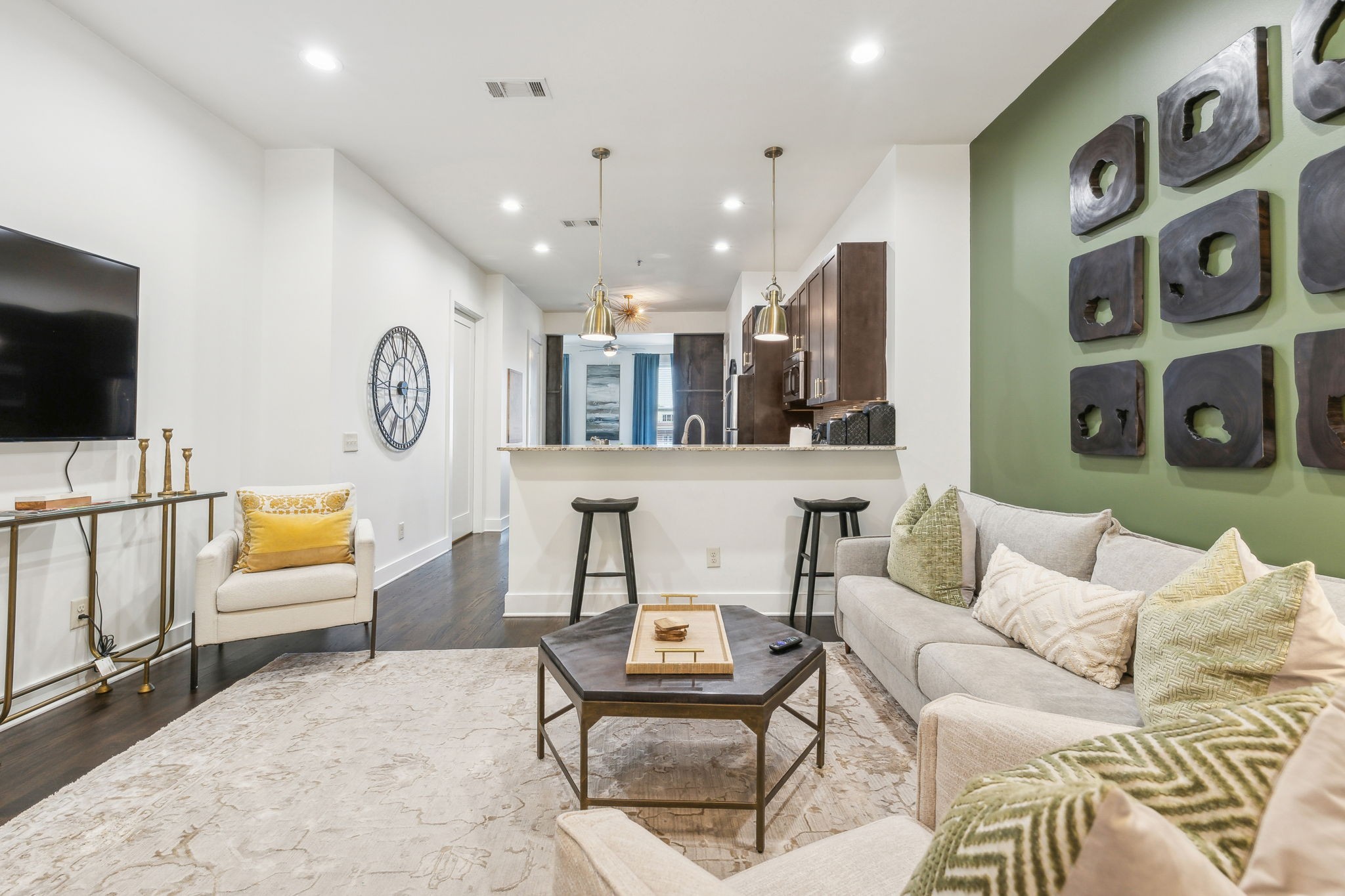 a living room with furniture and a flat screen tv