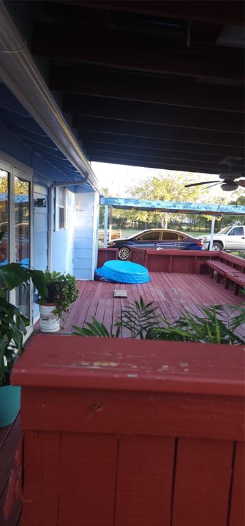 a backyard of a house with a yard table and chairs