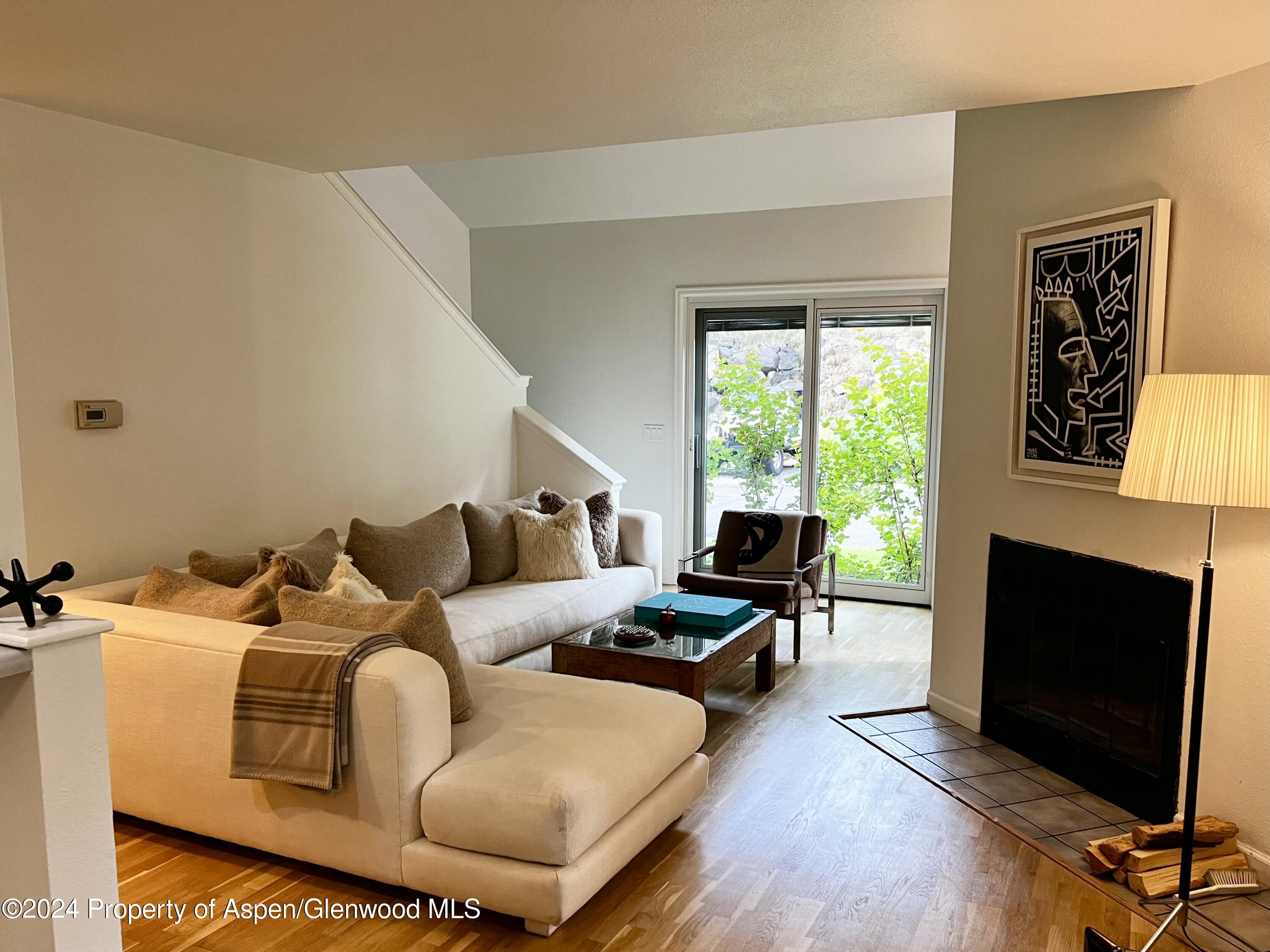 a living room with furniture fireplace and a flat screen tv