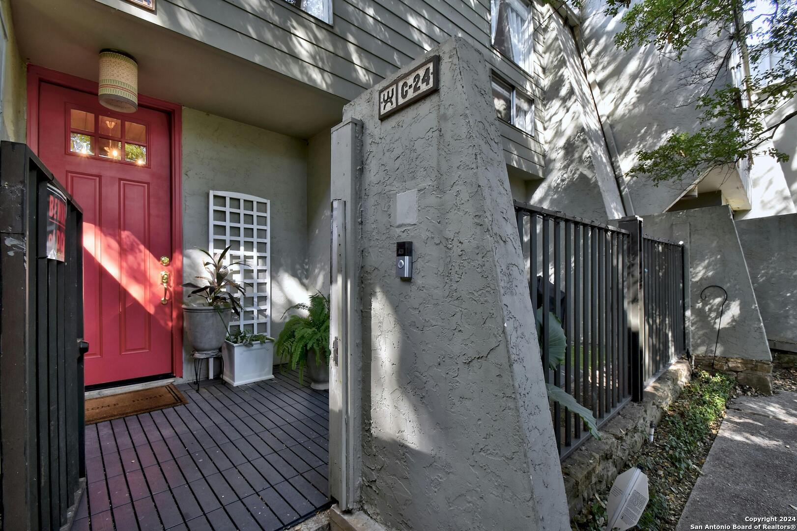 a view of a house with brick walls