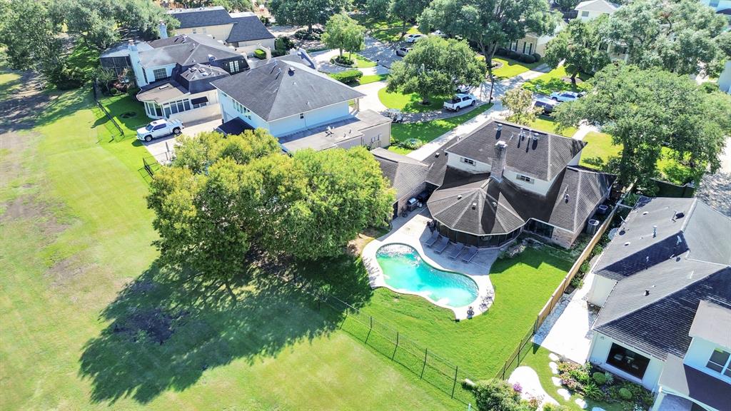 an aerial view of residential house with outdoor space and swimming pool