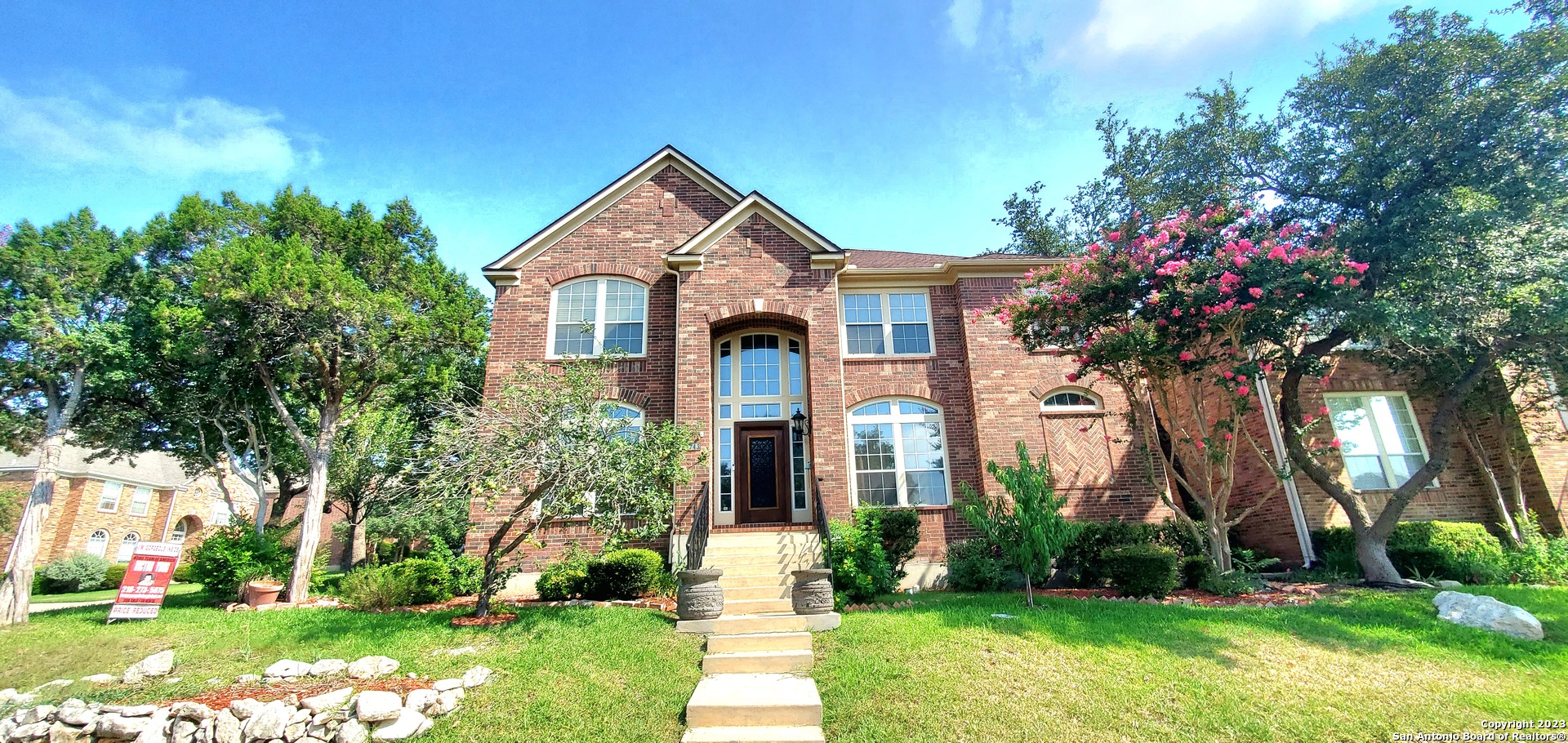 front view of a house with a yard