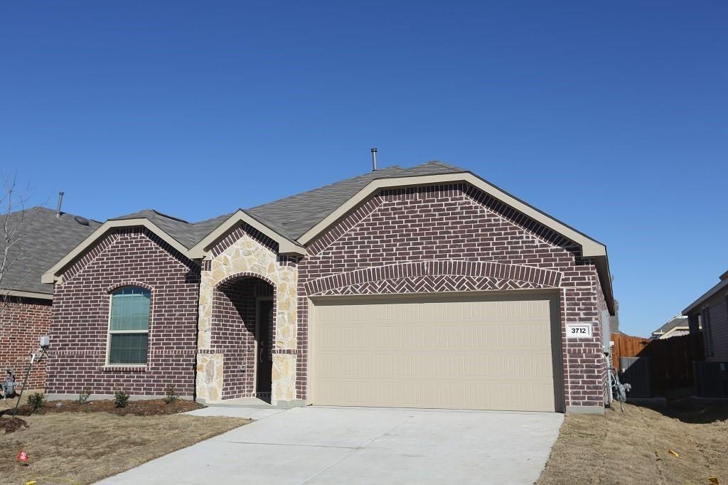 a front view of a house with a garage