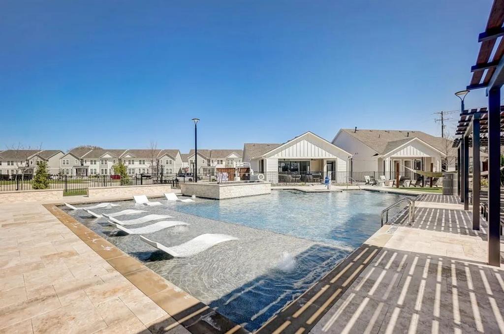 a view of a swimming pool with a lounge chairs