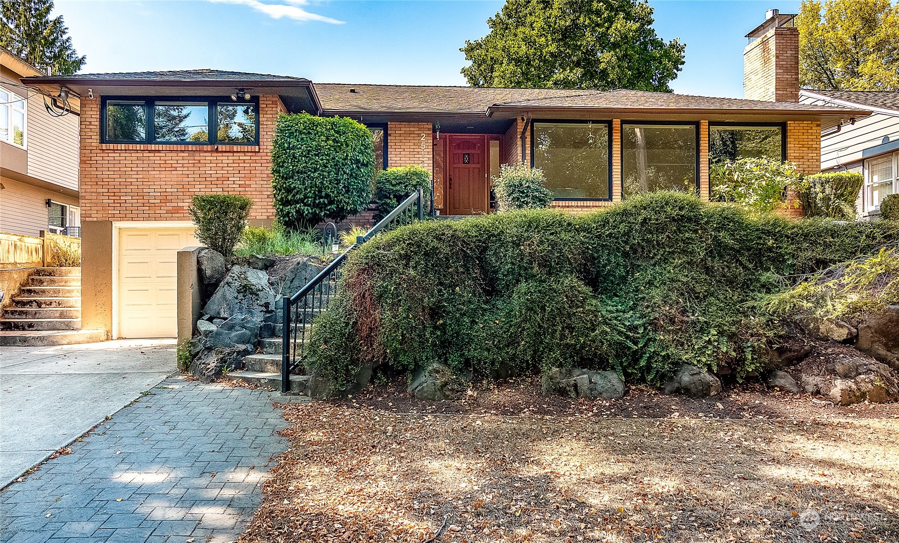 a front view of a house with garden