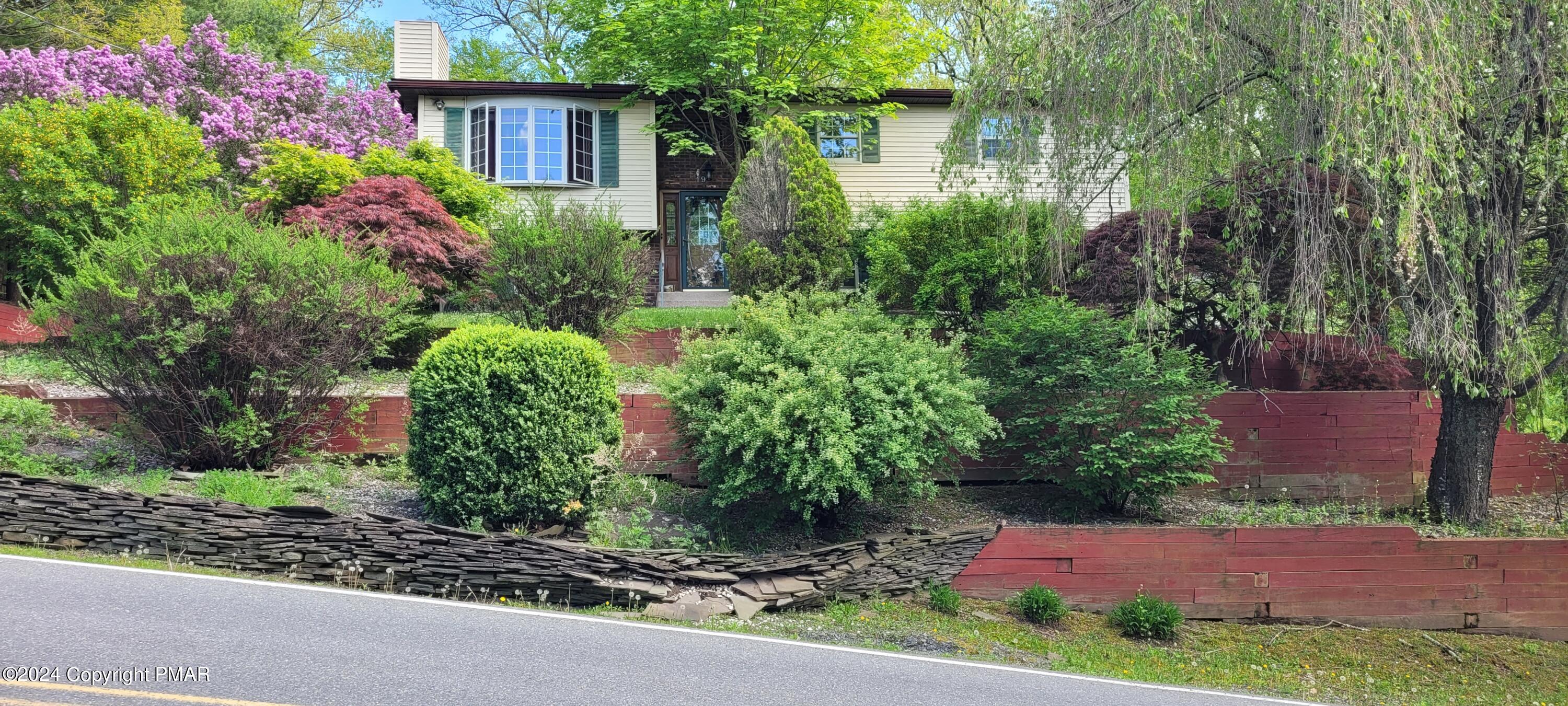 a view of a backyard with a garden