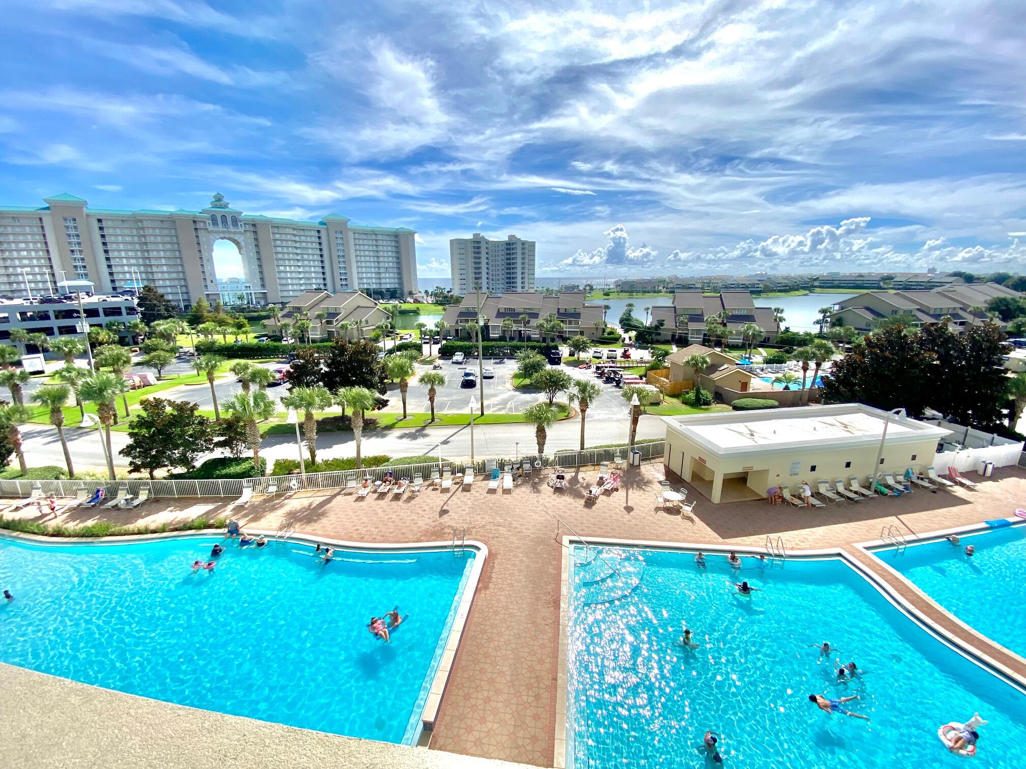 a view of a swimming pool with outdoor seating