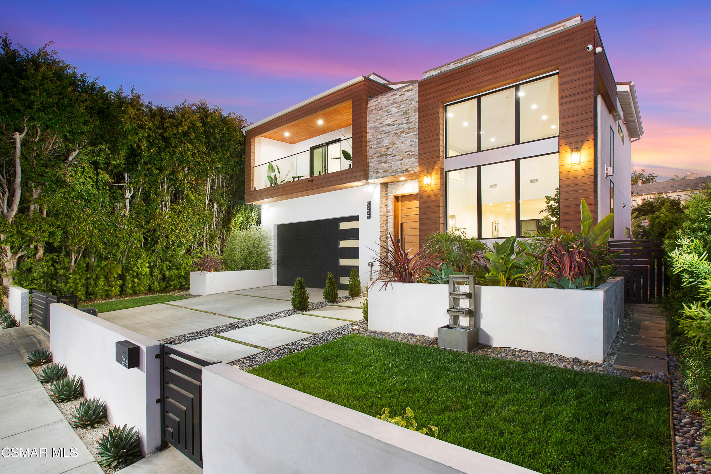 a view of an house with backyard space and garden