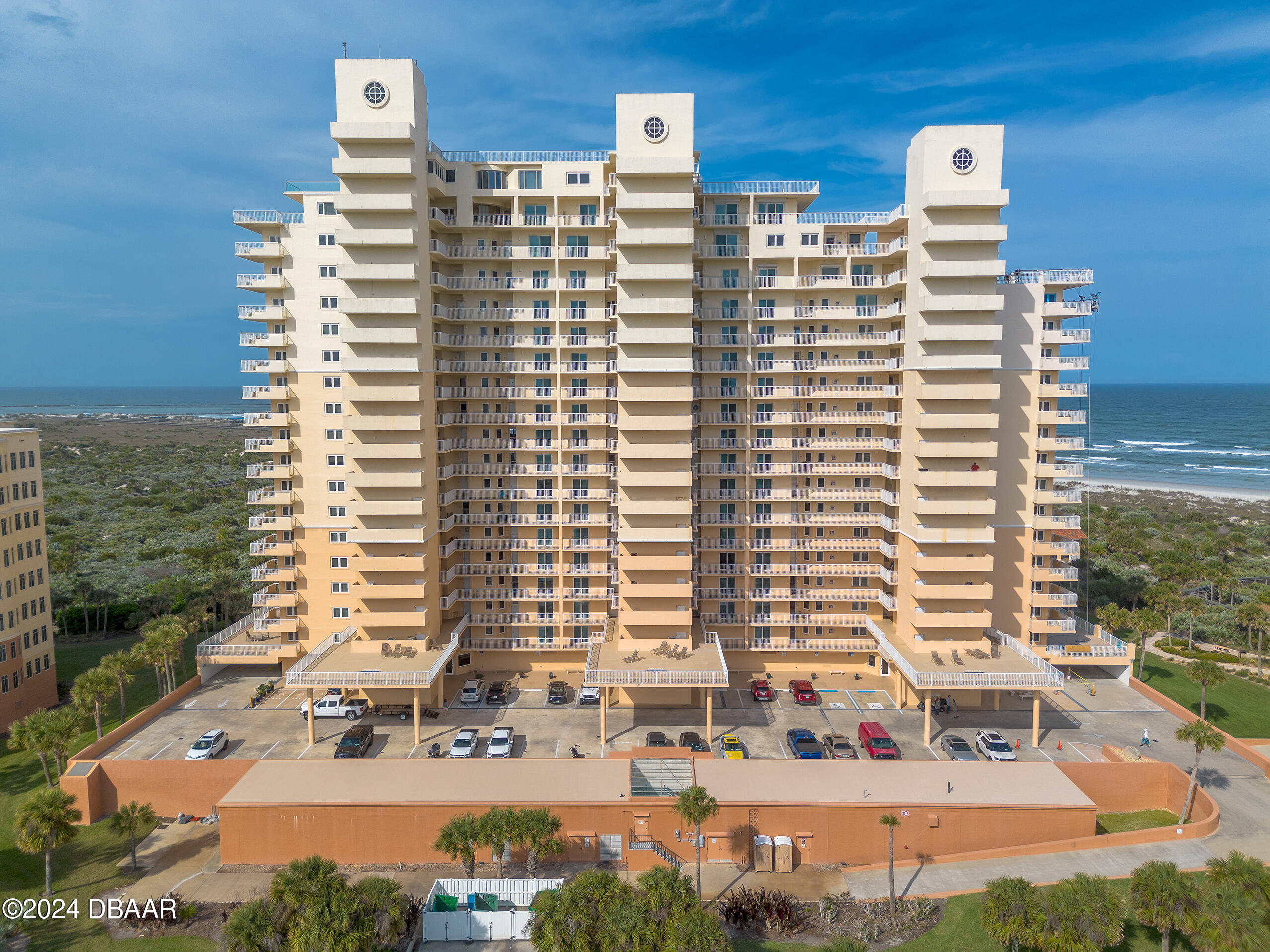 a front view of a building with outdoor space