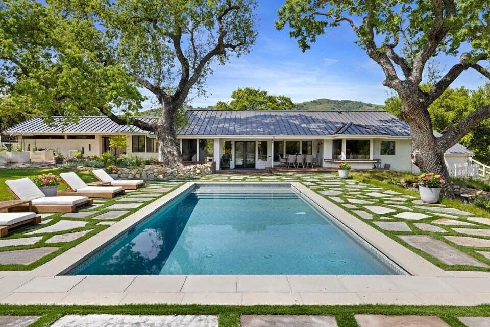 a view of swimming pool with outdoor seating