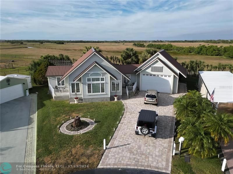 an aerial view of a house having yard