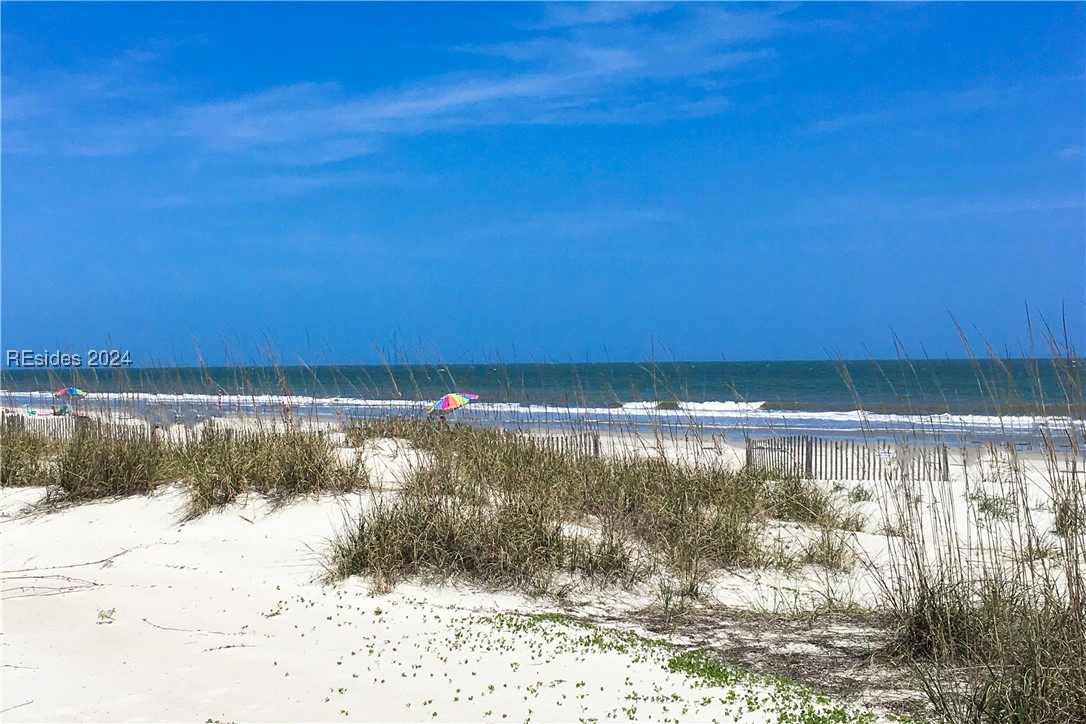 Property view of water with a beach view