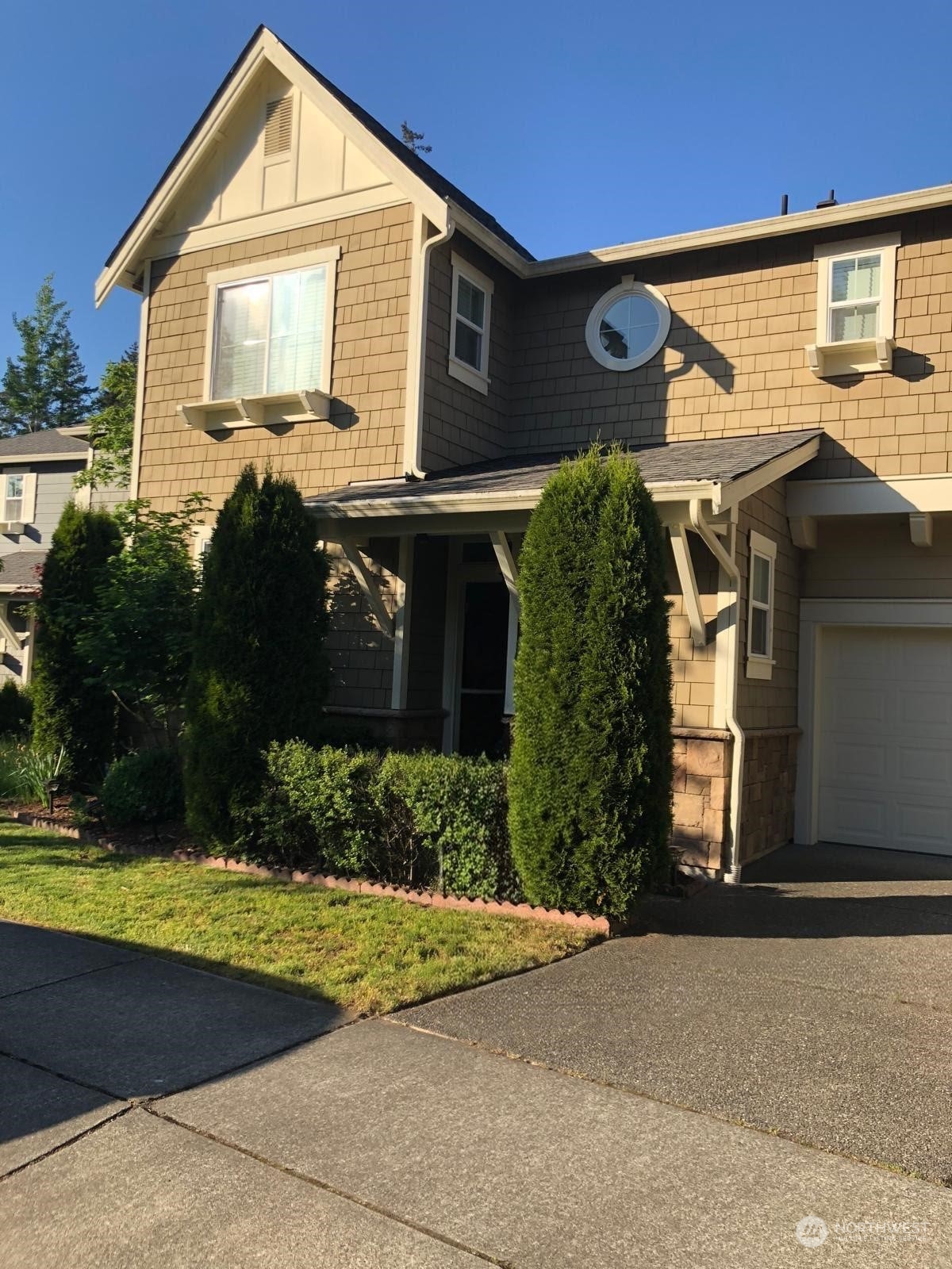 a front view of a house with garden