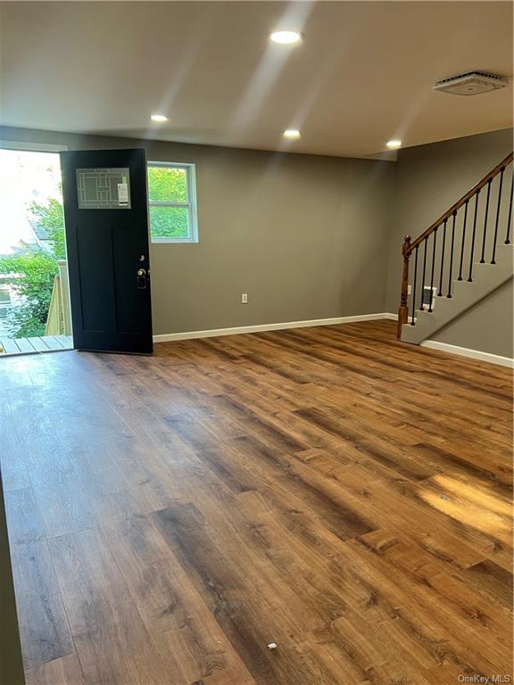 Entrance foyer featuring wood-type flooring