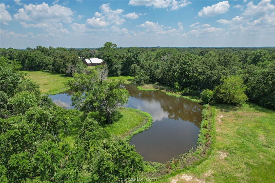 an aerial view of a houses with lake view