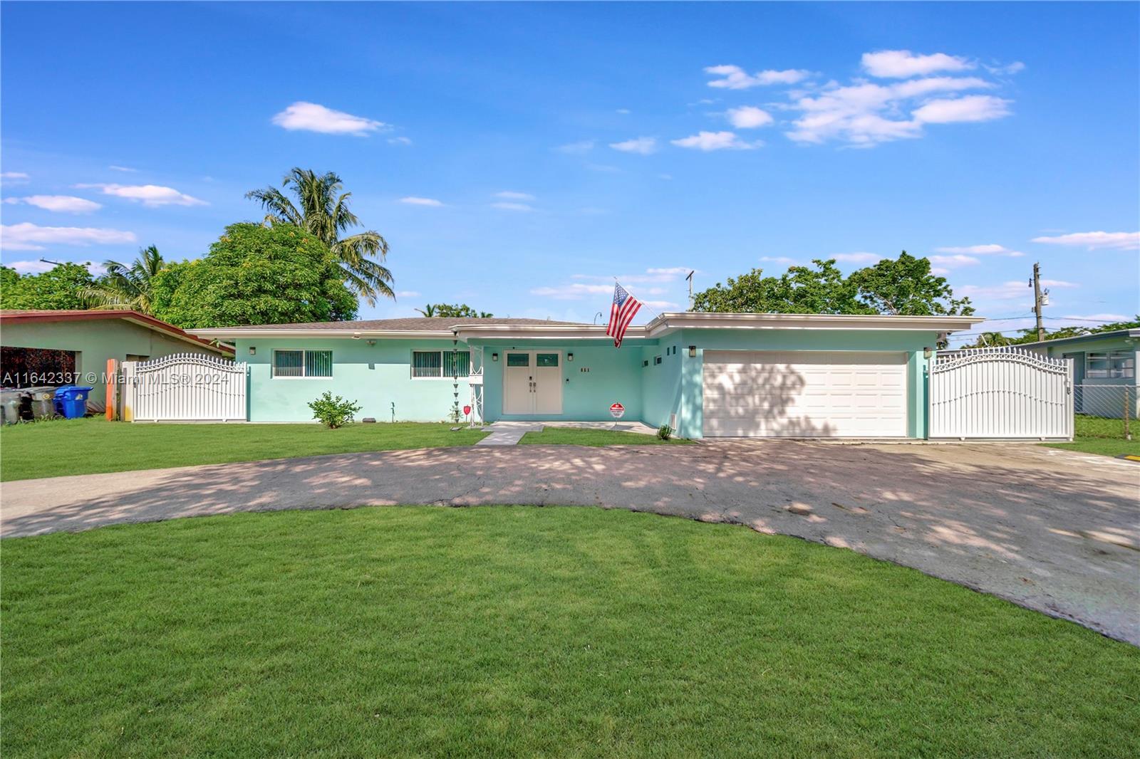 a view of house with backyard