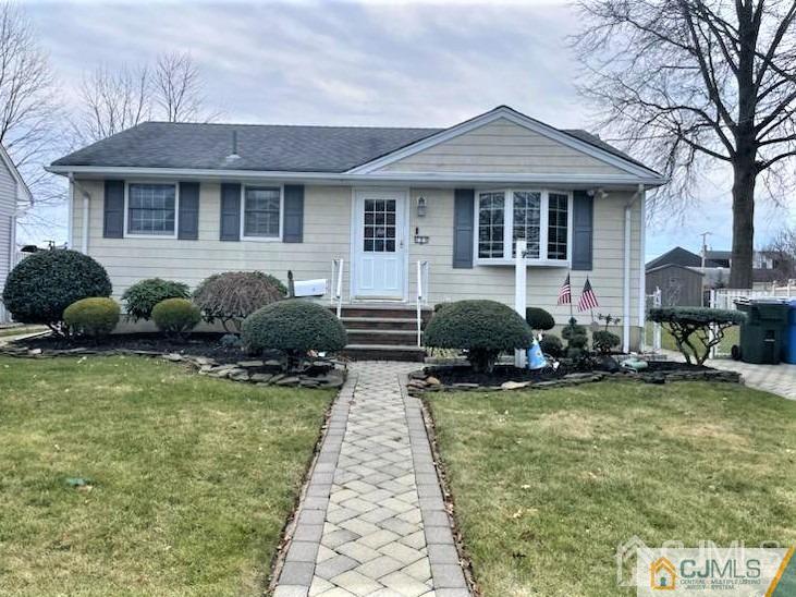 a front view of house with yard and outdoor seating