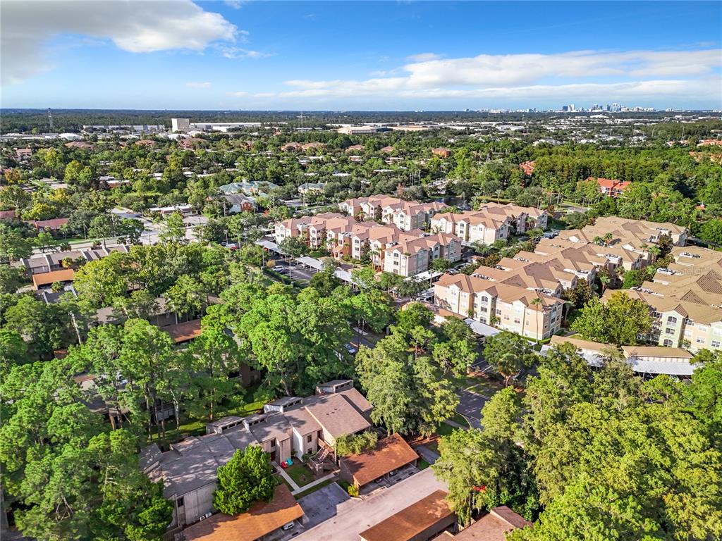 an aerial view of residential houses with outdoor space