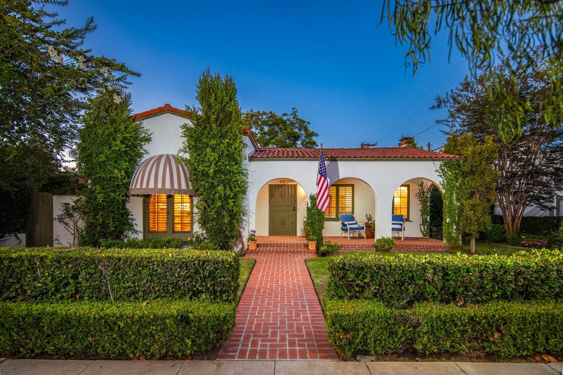 a front view of a house with garden