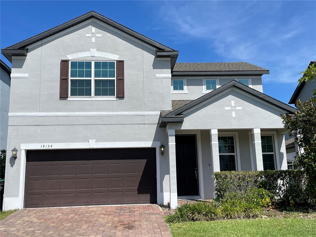 a front view of a house with garage