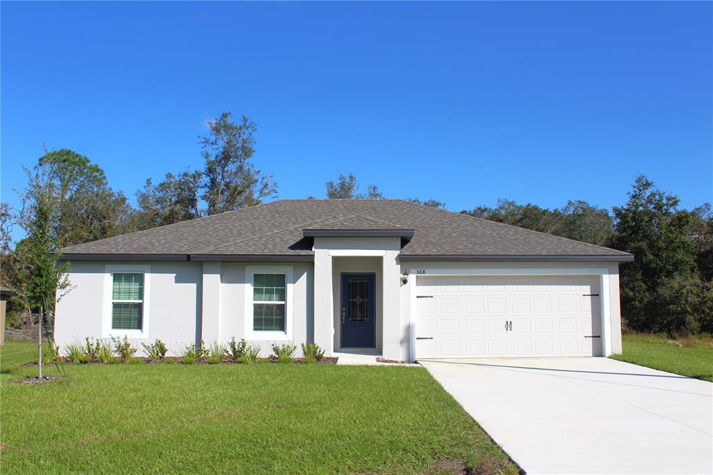 front view of a house with a yard