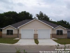 a view of a yard in front of a house with garage