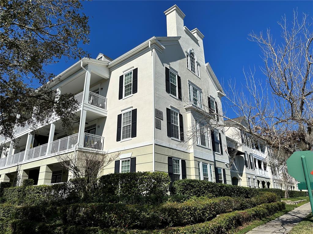 a front view of a building with a yard