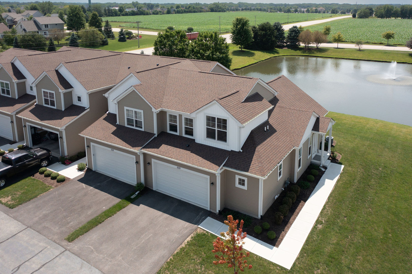 an aerial view of a house with a lake view