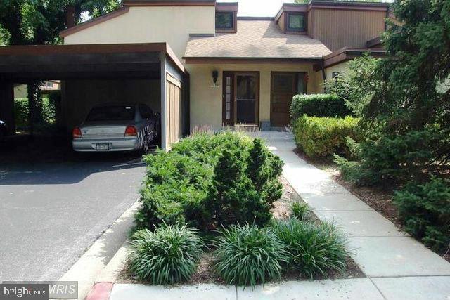 a view of a car park in front of house