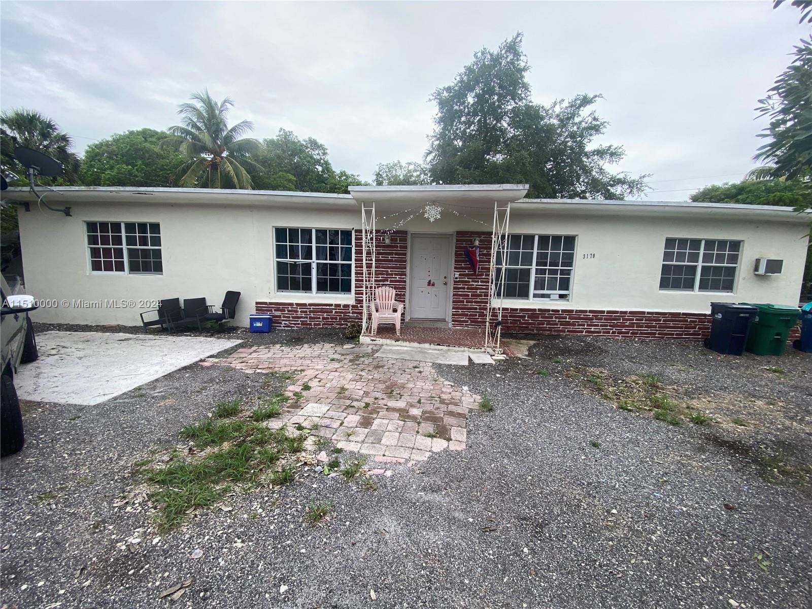 front view of a house with a yard