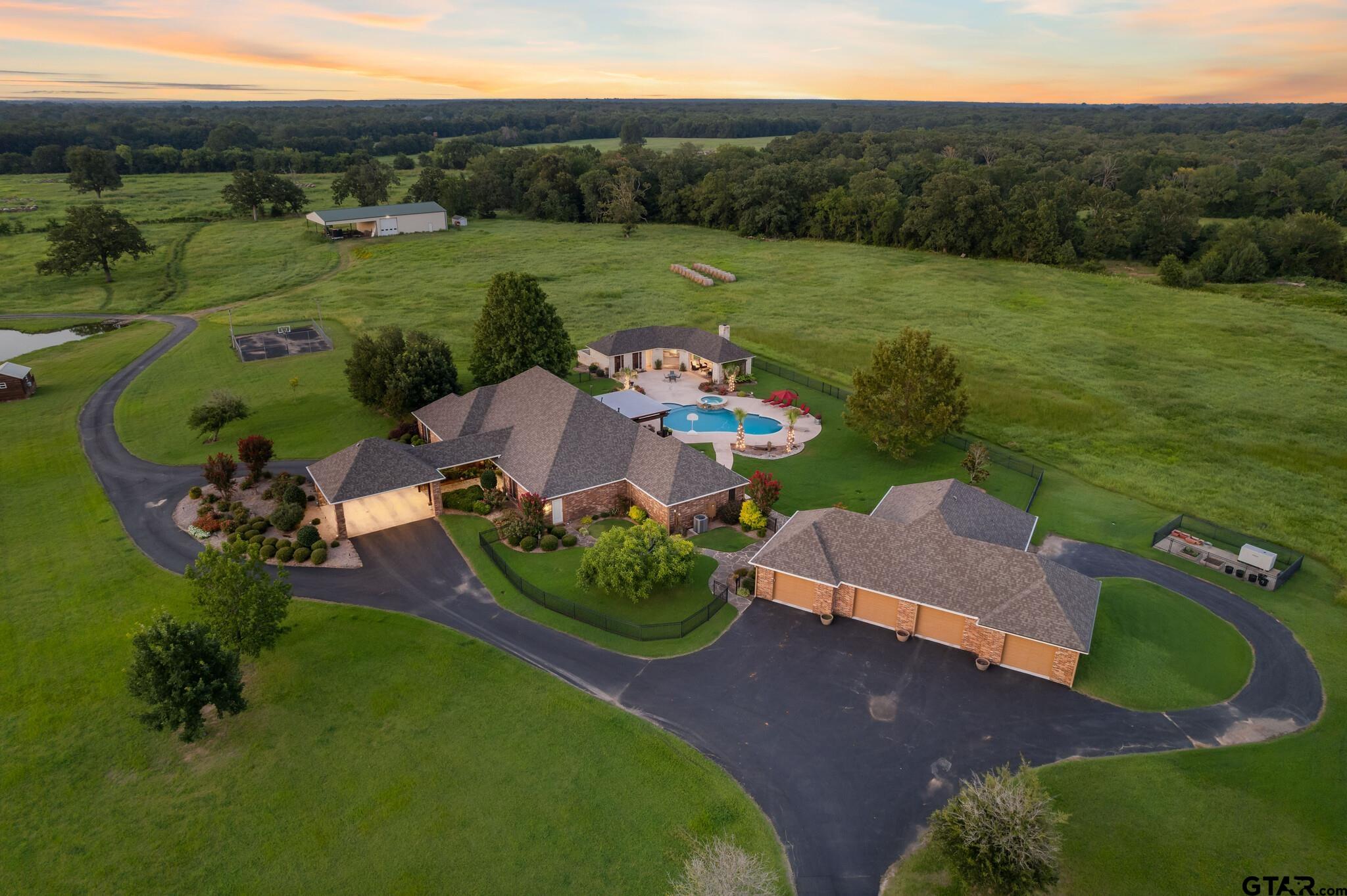 an aerial view of a house with garden space and street view