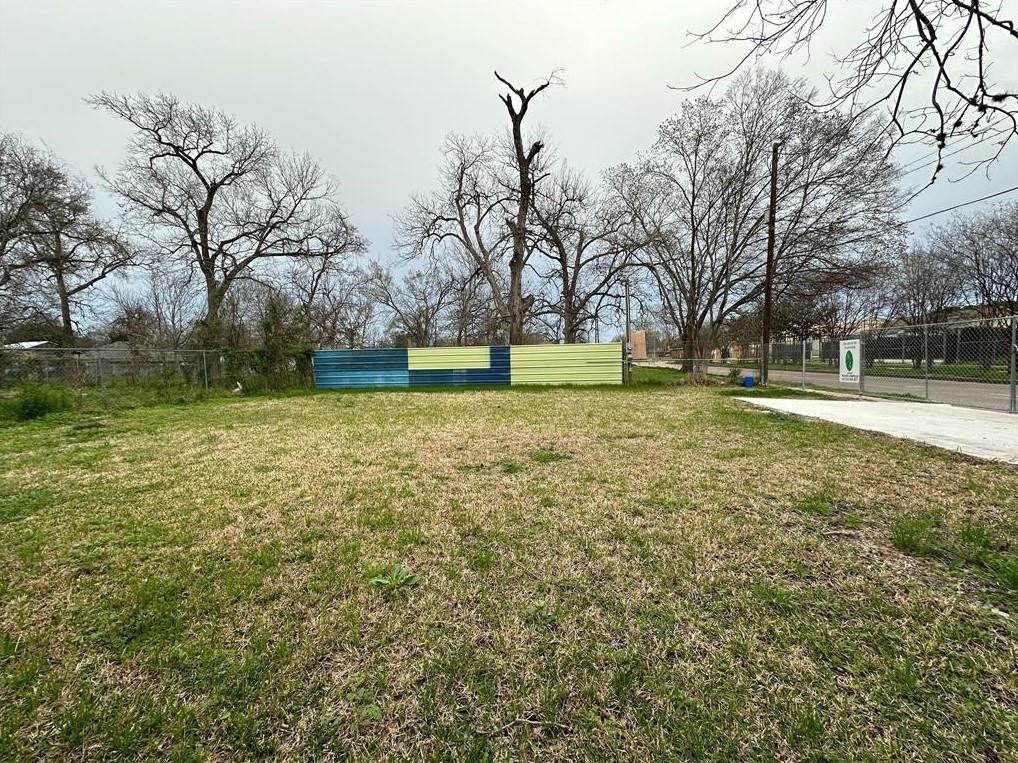 a big yard with lots of green space and trees