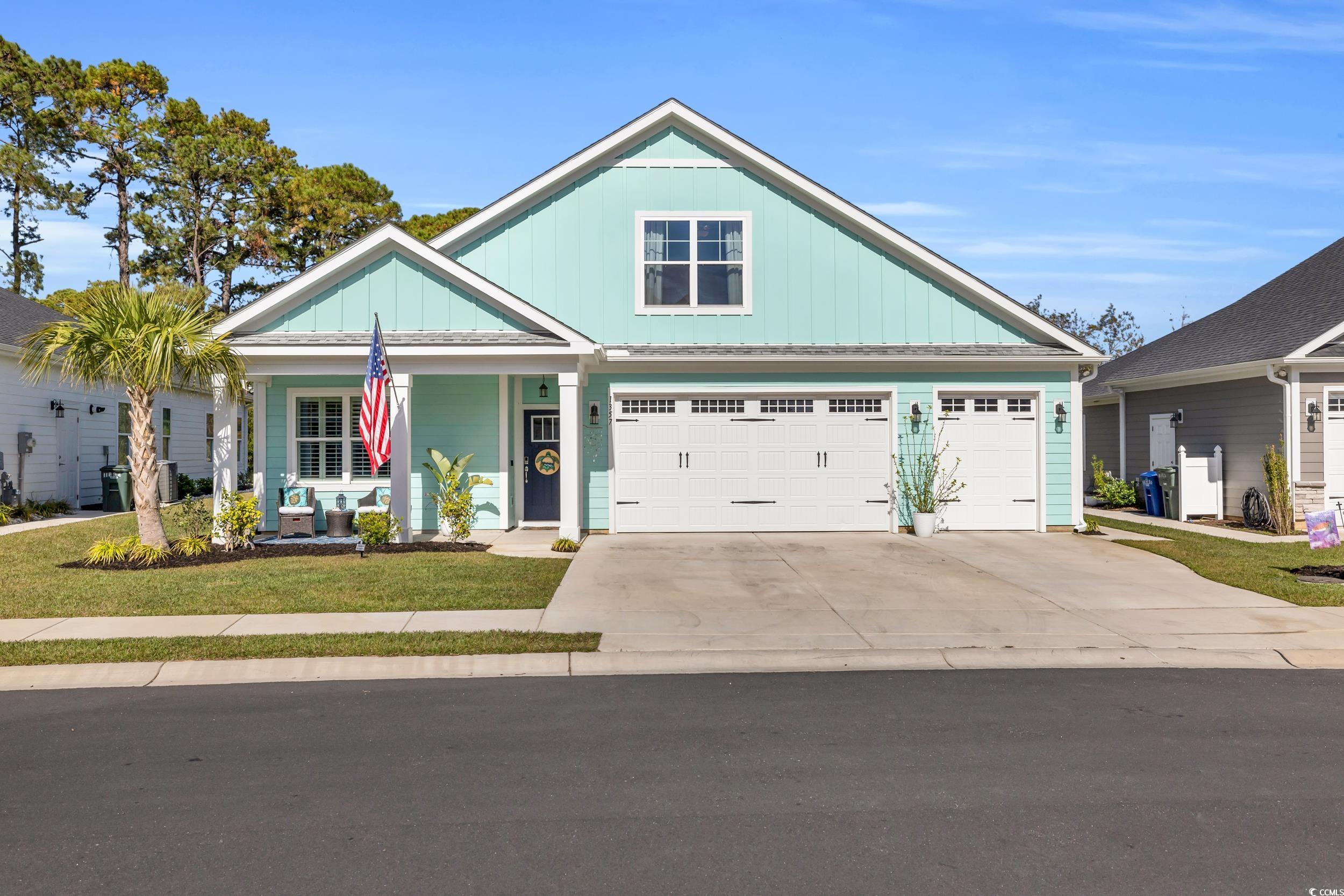 Craftsman-style home with a garage and a porch