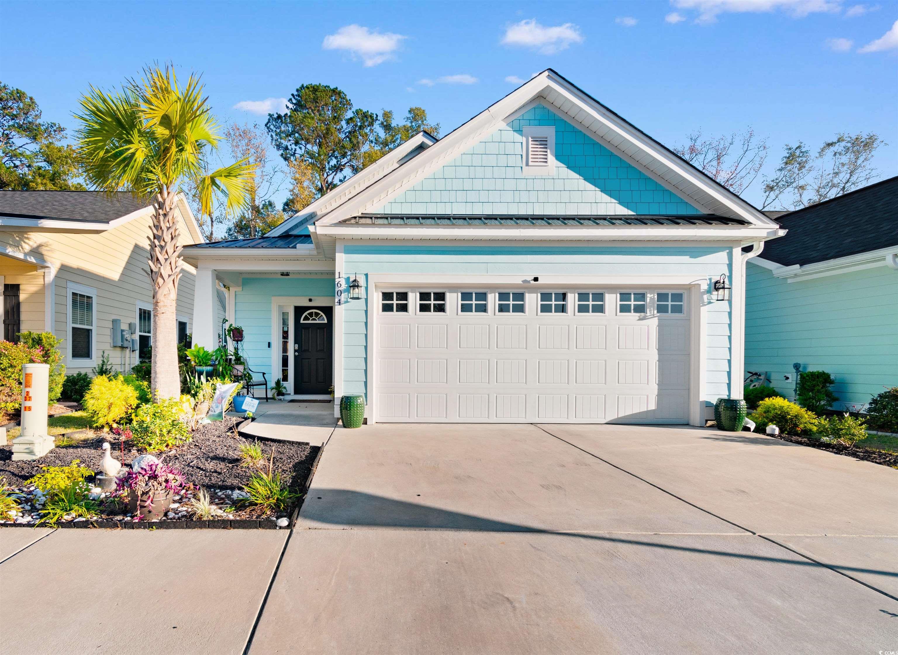 View of front of property featuring a garage