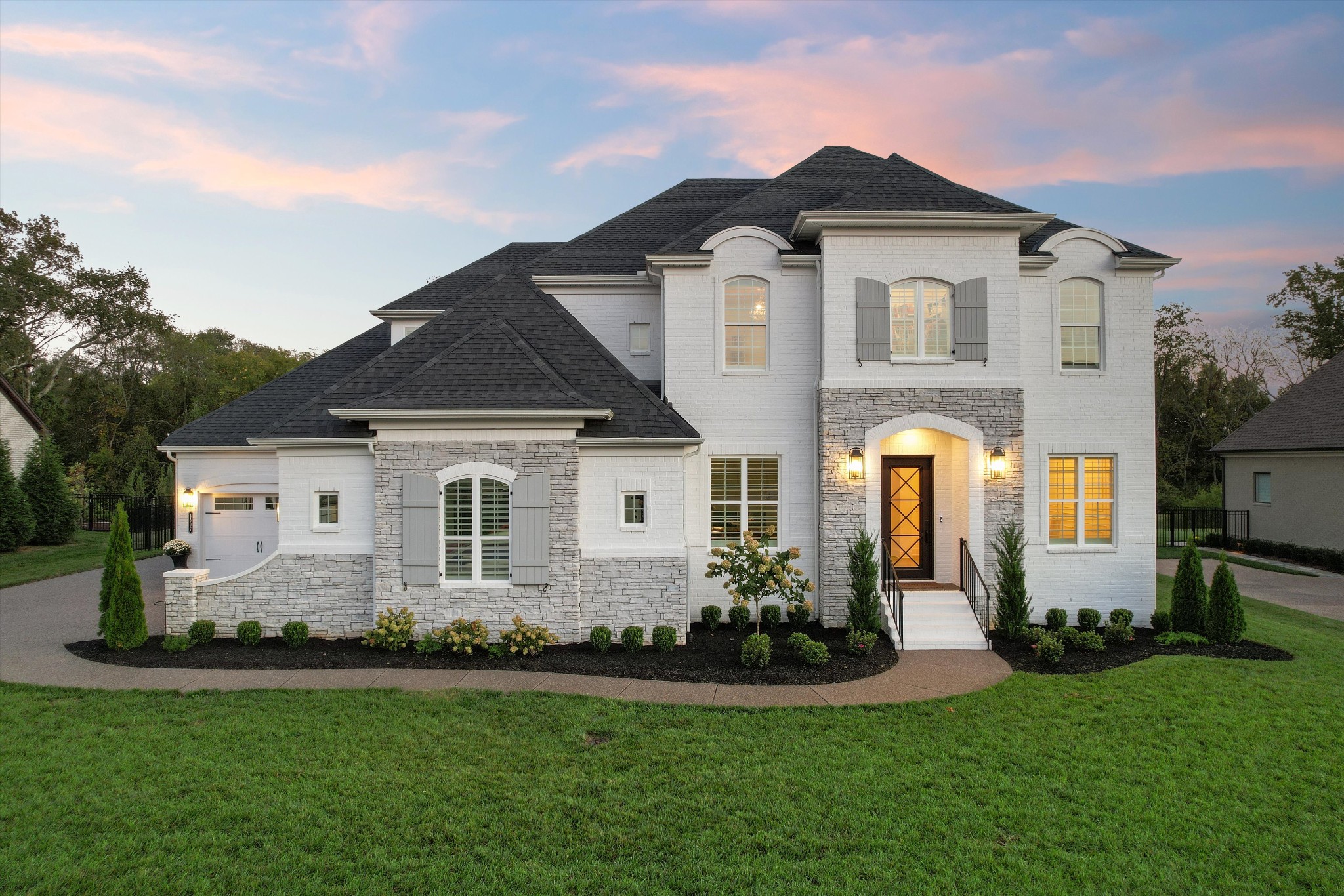 a front view of a house with a yard