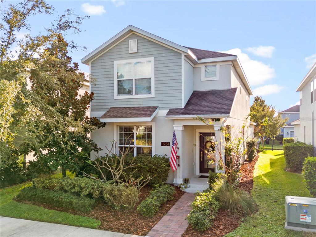 a front view of a house with garden