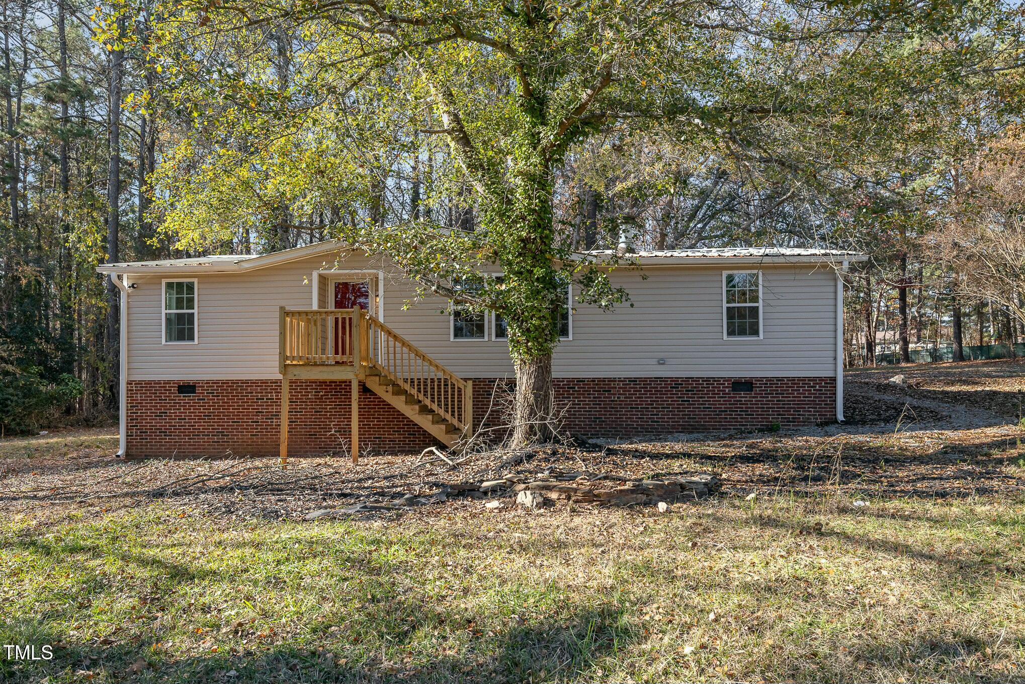 a house with trees in the background