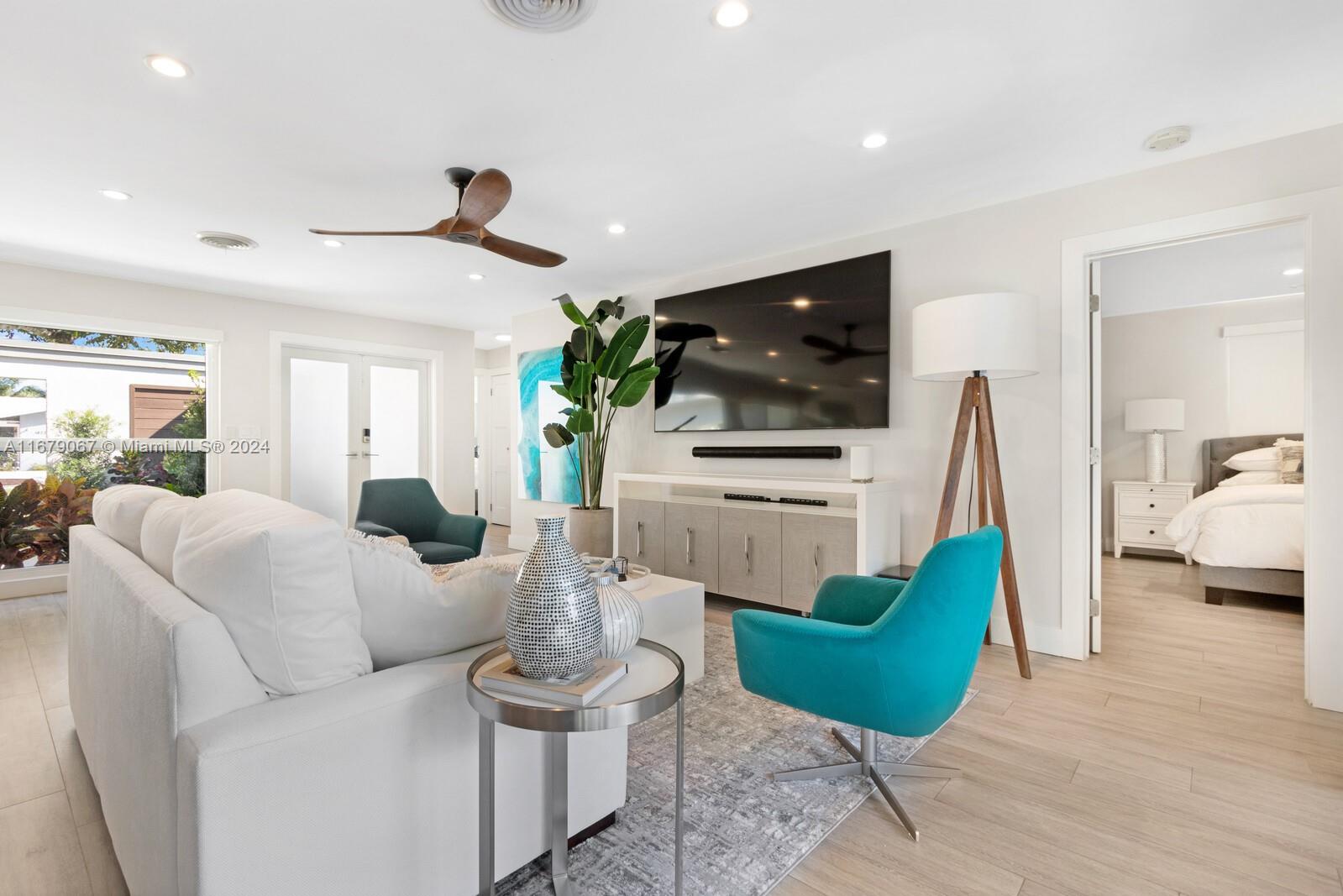 a living room with furniture and a flat screen tv