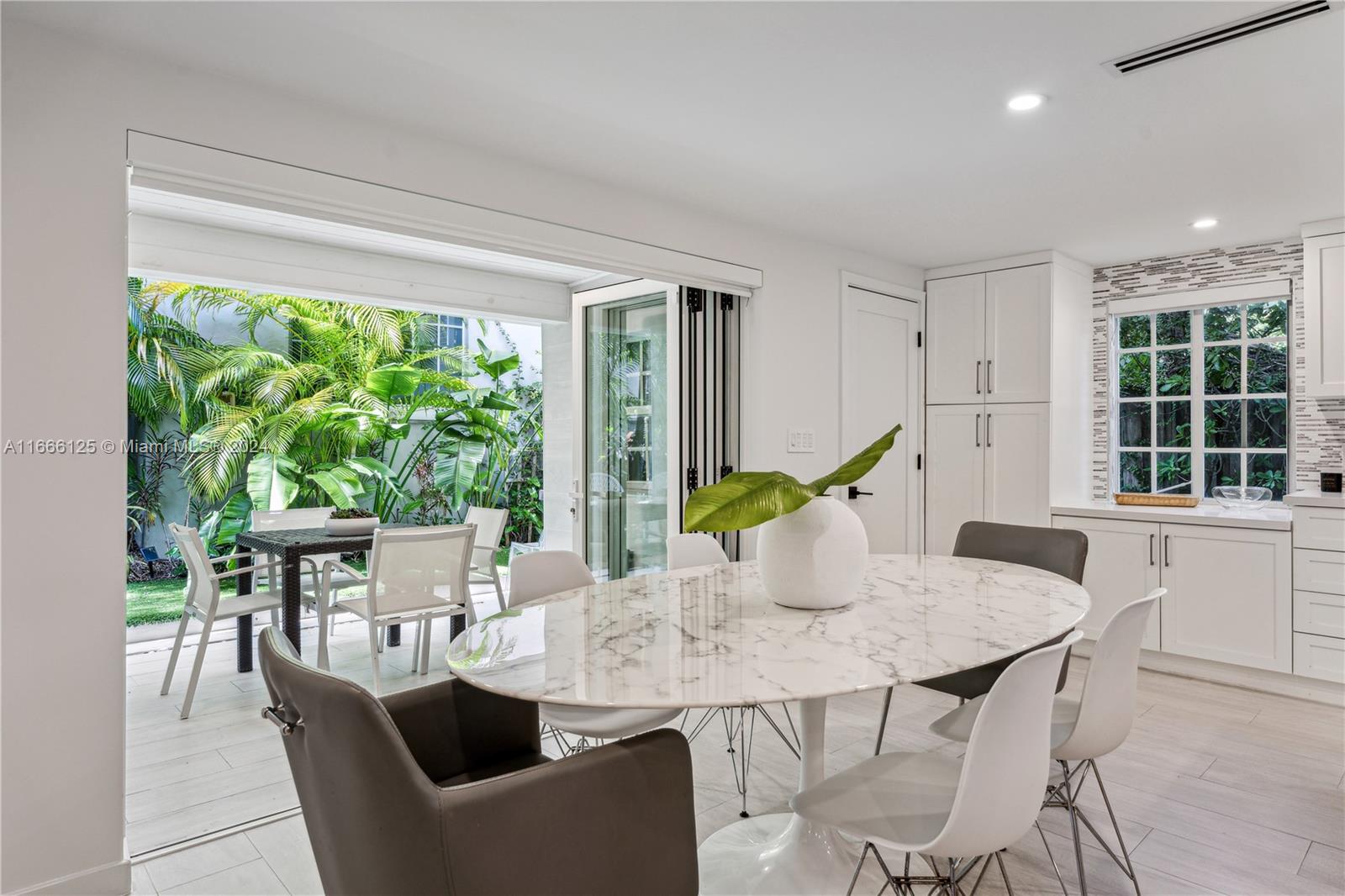 a view of a dining room with furniture window and outside view