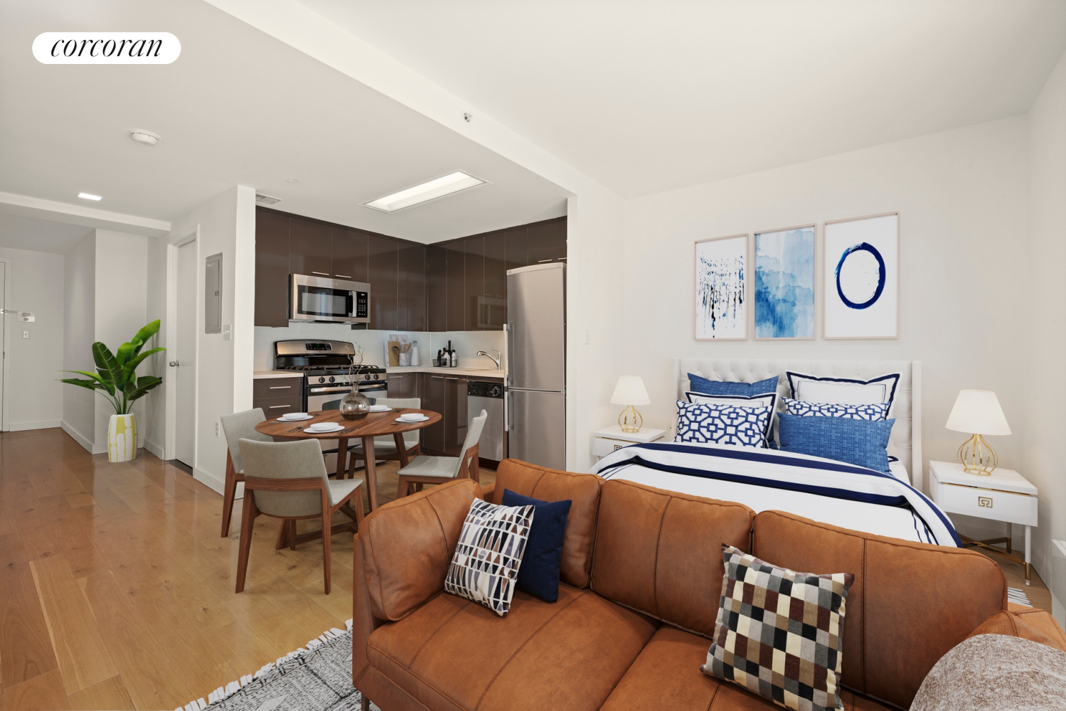 a living room with furniture kitchen view and a window