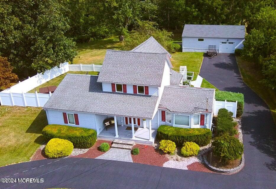 a aerial view of a house with swimming pool